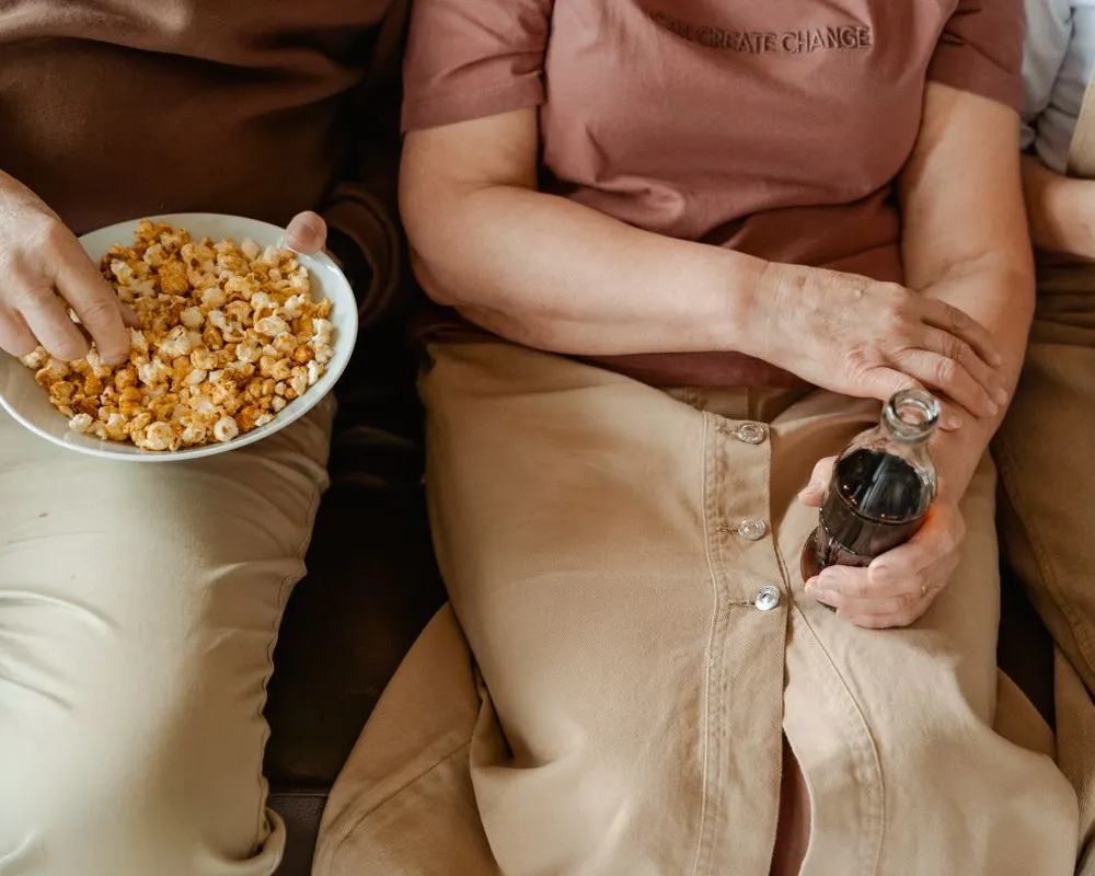 Friends sharing a bowl of snacks